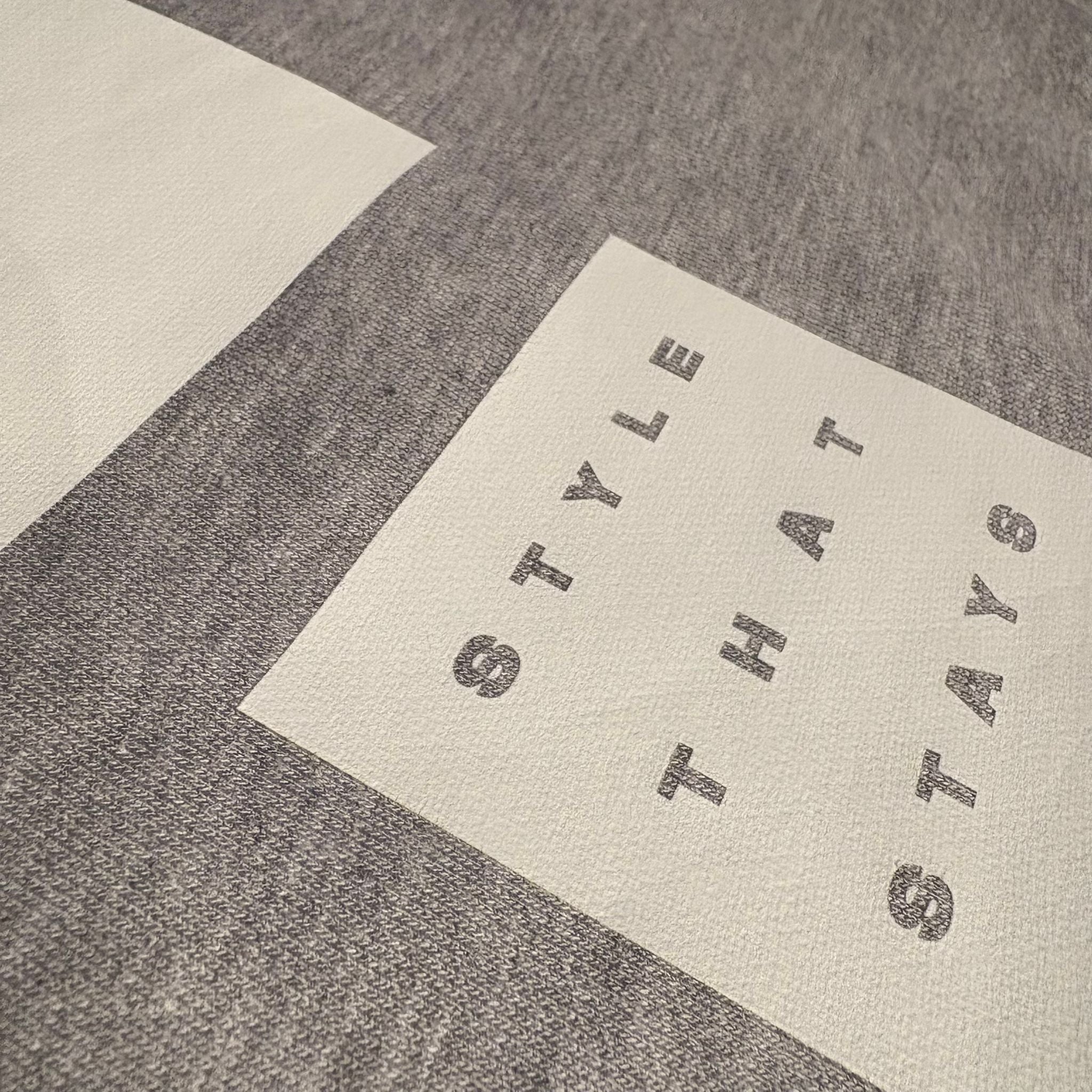 Textured surface with 'STYLE THAT STAYS' text