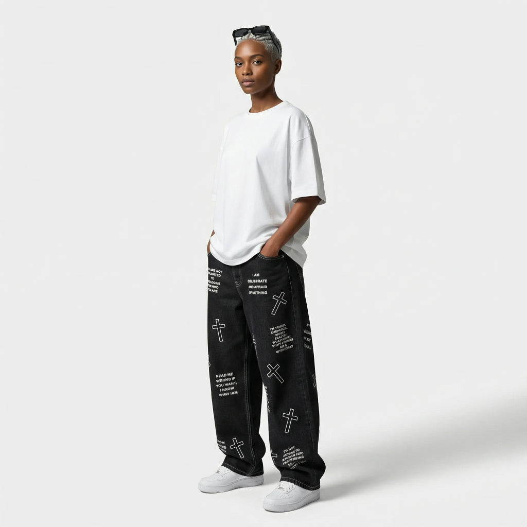 Person wearing a white t-shirt and black pants with text and cross designs on a white background