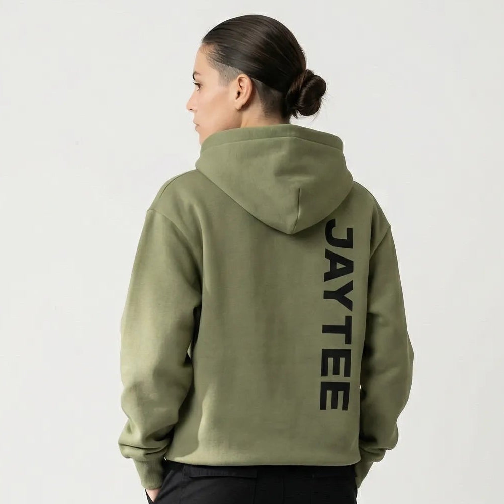 Person wearing a green hoodie with JAYTEE branding on the back, standing against a white background.