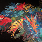 Colorful abstract design with leaf-like shapes on a black background