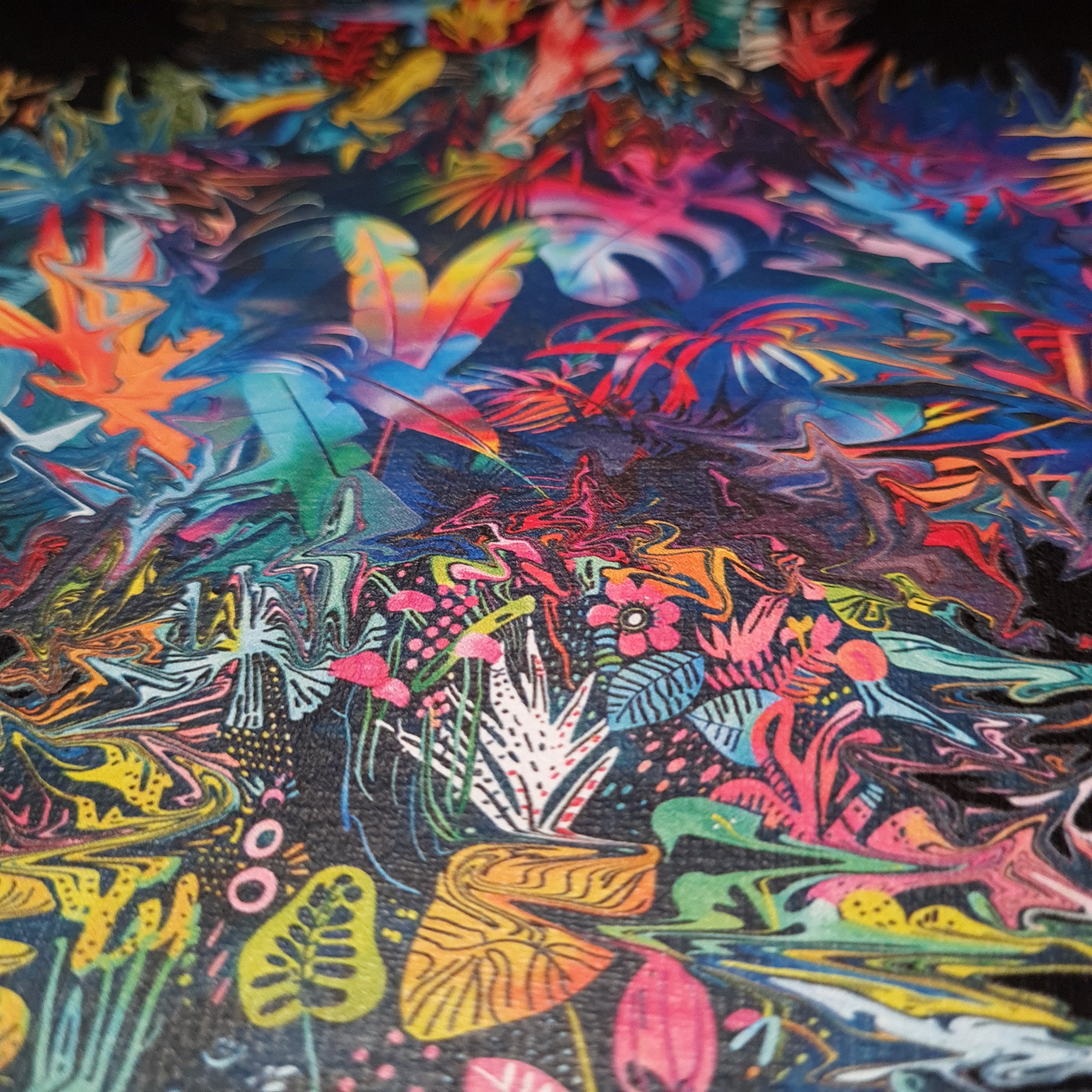 Colorful abstract pattern with various shapes and colors on a dark background