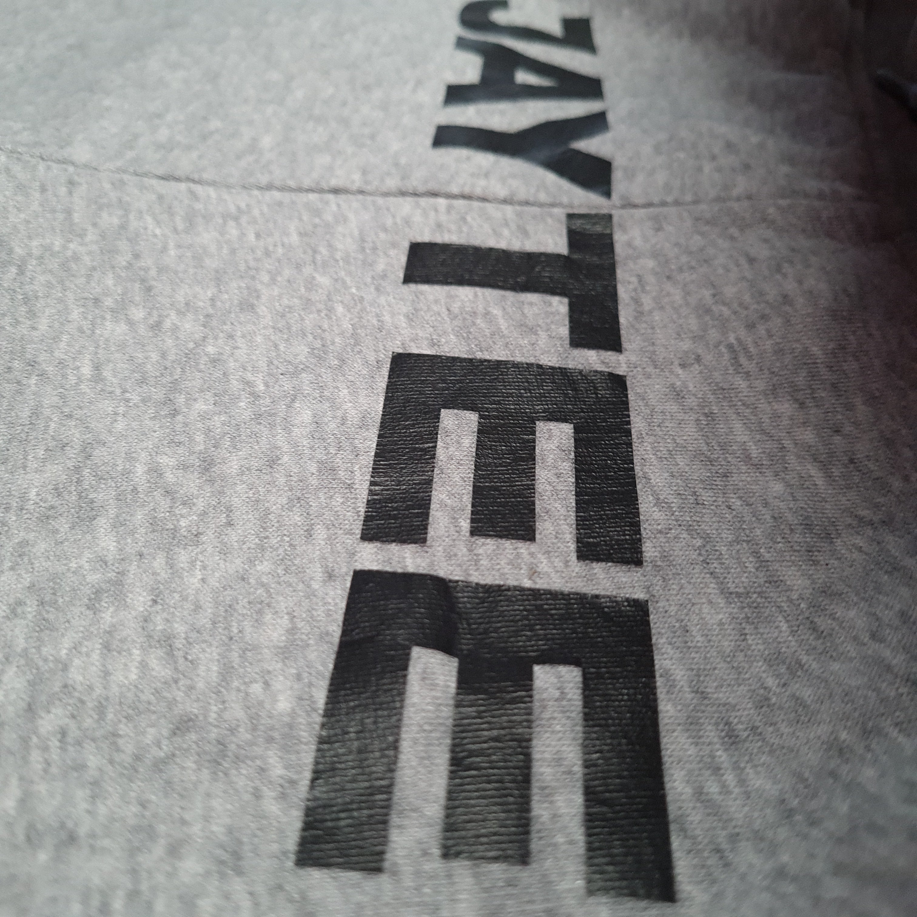 Gray hoodie with 'JAY TEE' printed on it