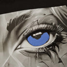Artistic depiction of a close-up eye with blue reflection, surrounded by black and white elements.