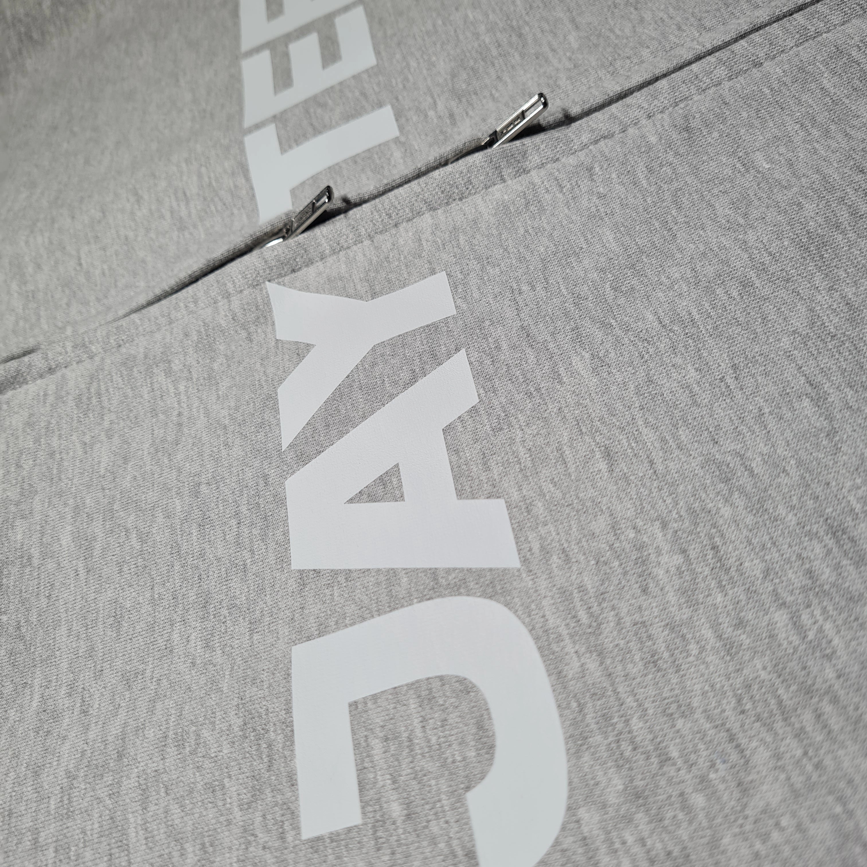 Gray hoodie with white branding on a gray background