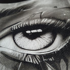 Close-up of a detailed black and white drawing of an eye