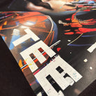 Close-up of a colorful graphic design with abstract shapes and text.