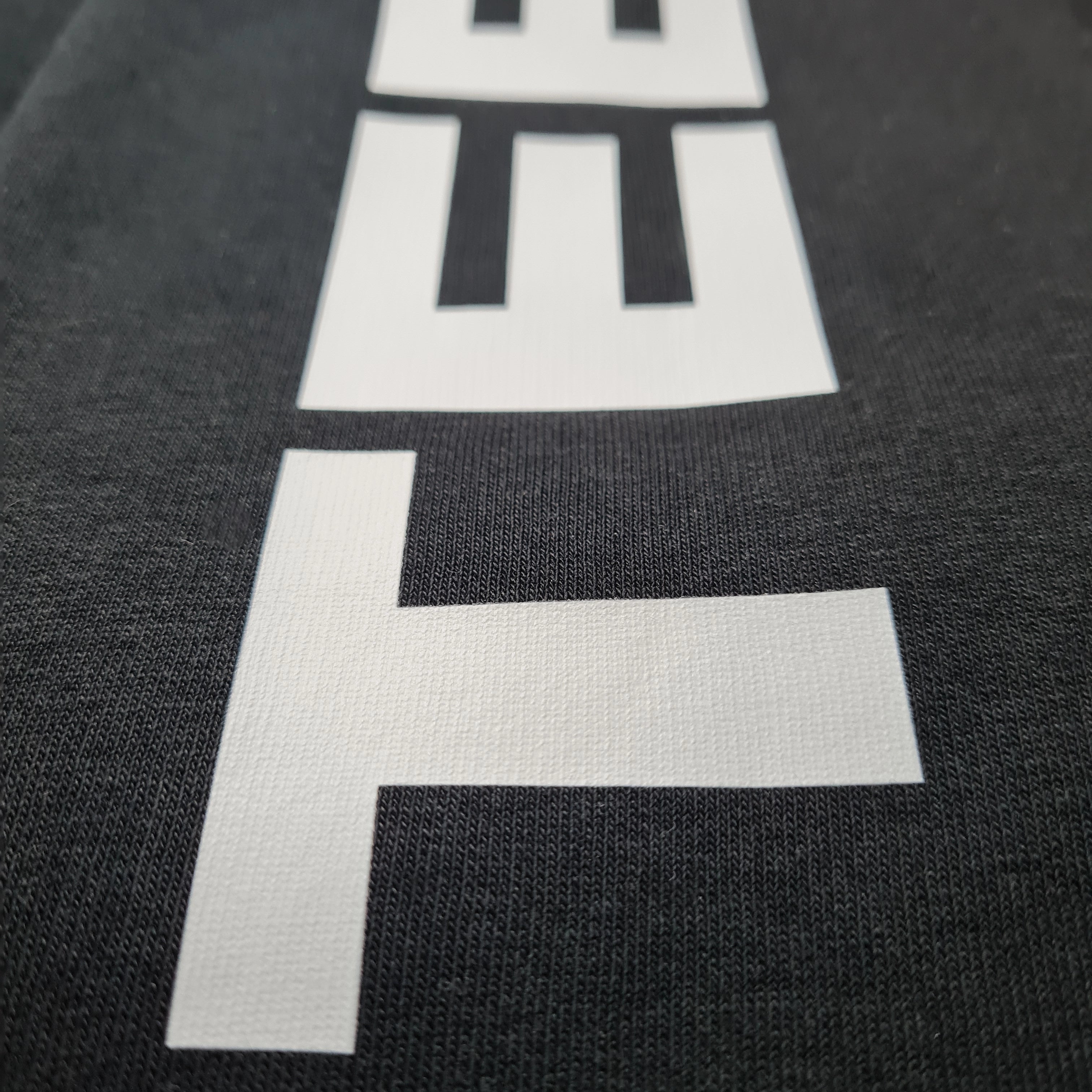 Joggers close up of fabric and JAYTEE logo