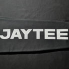 JAYTEE closeup of joggers on black background