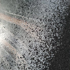 Close-up of a textured surface with black and white patterns