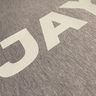 Close-up of a textured fabric with 'Dakota' printed in white.