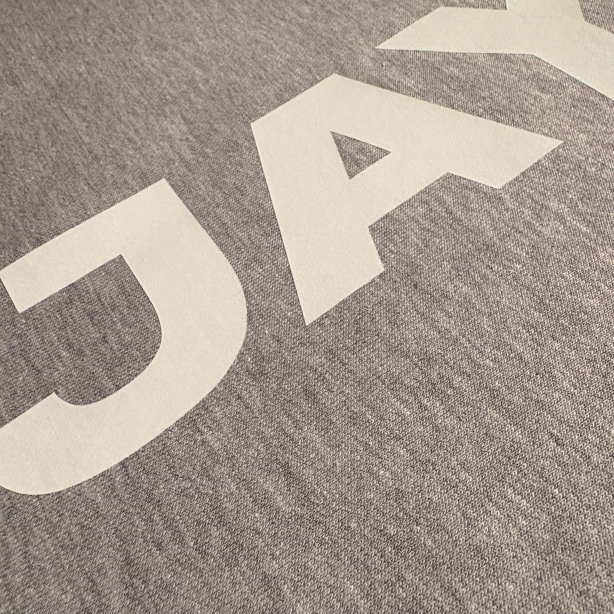 Close-up of a textured fabric with 'Dakota' printed in white.