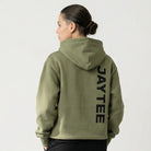 Person wearing a green hoodie with JAYTEE branding on the back, standing against a white background.